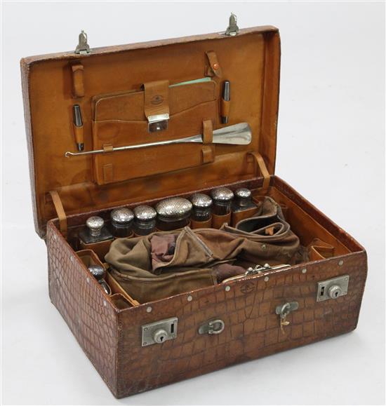 An early 20th century crocodile toilet case, 22in.